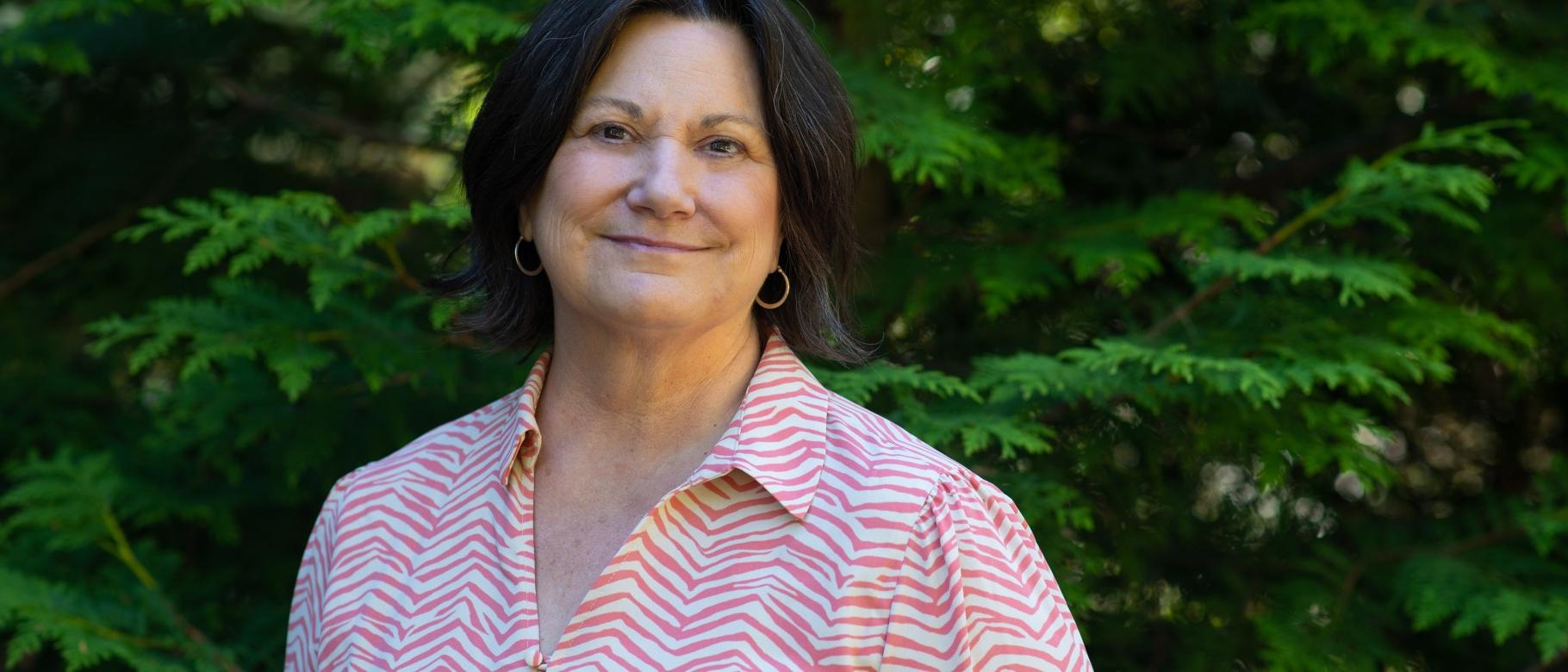 Portrait of Jennifer Morton against trees