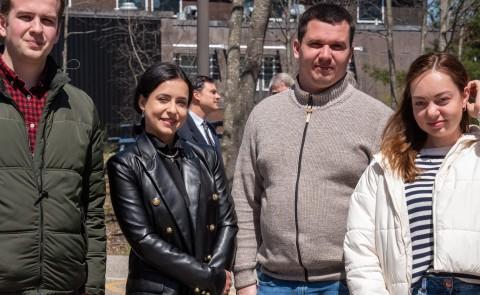 Members of a Ukrainian delegation pose in front of UNE's Marine Science Center