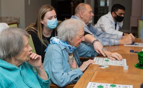 UNE health professions students play bingo with seniors at an assisted living facility