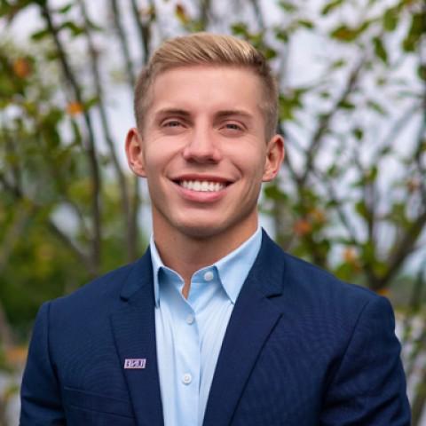 U N E board of trustees student trustee Brock Johndro